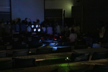 Students carrying out experiments using parabolic reflectors.